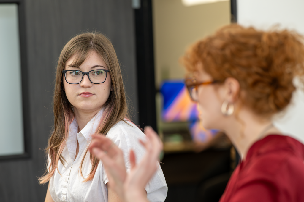 Employees engaged in an active discussion.