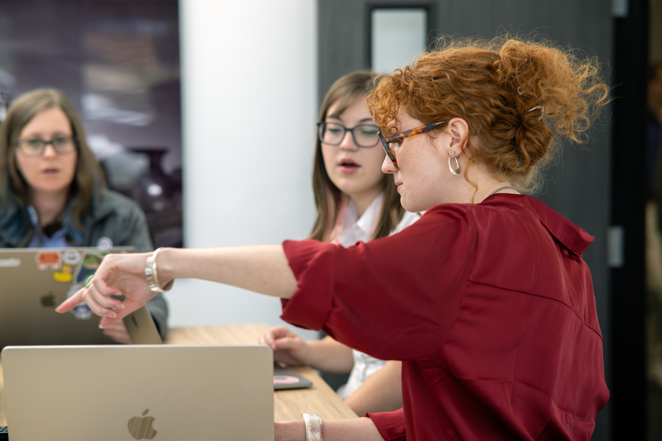 Employees looking at a website that is in the design process.