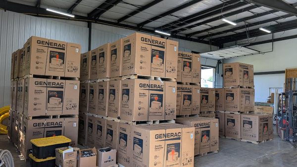 generac generators stacked in a warehouse